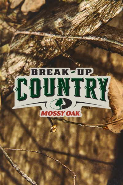 A full camouflage background design with 'Break-up Country Mossy Oak' logo in the center. 
DAM # aaf13785