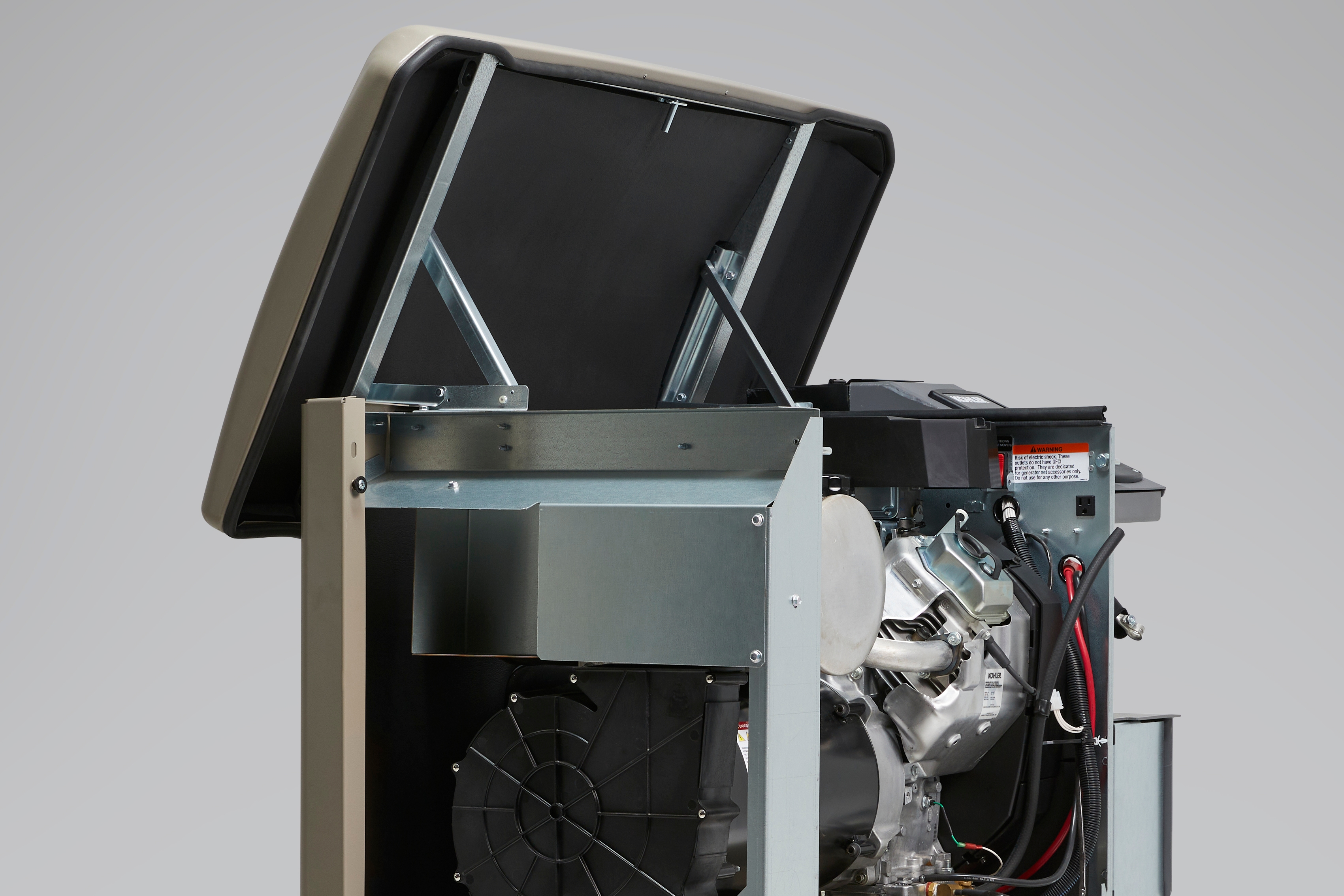HE - KOHLER generator with the lid open showing a KOHLER engine installed inside (side view)
DAM #aae74764_rgb