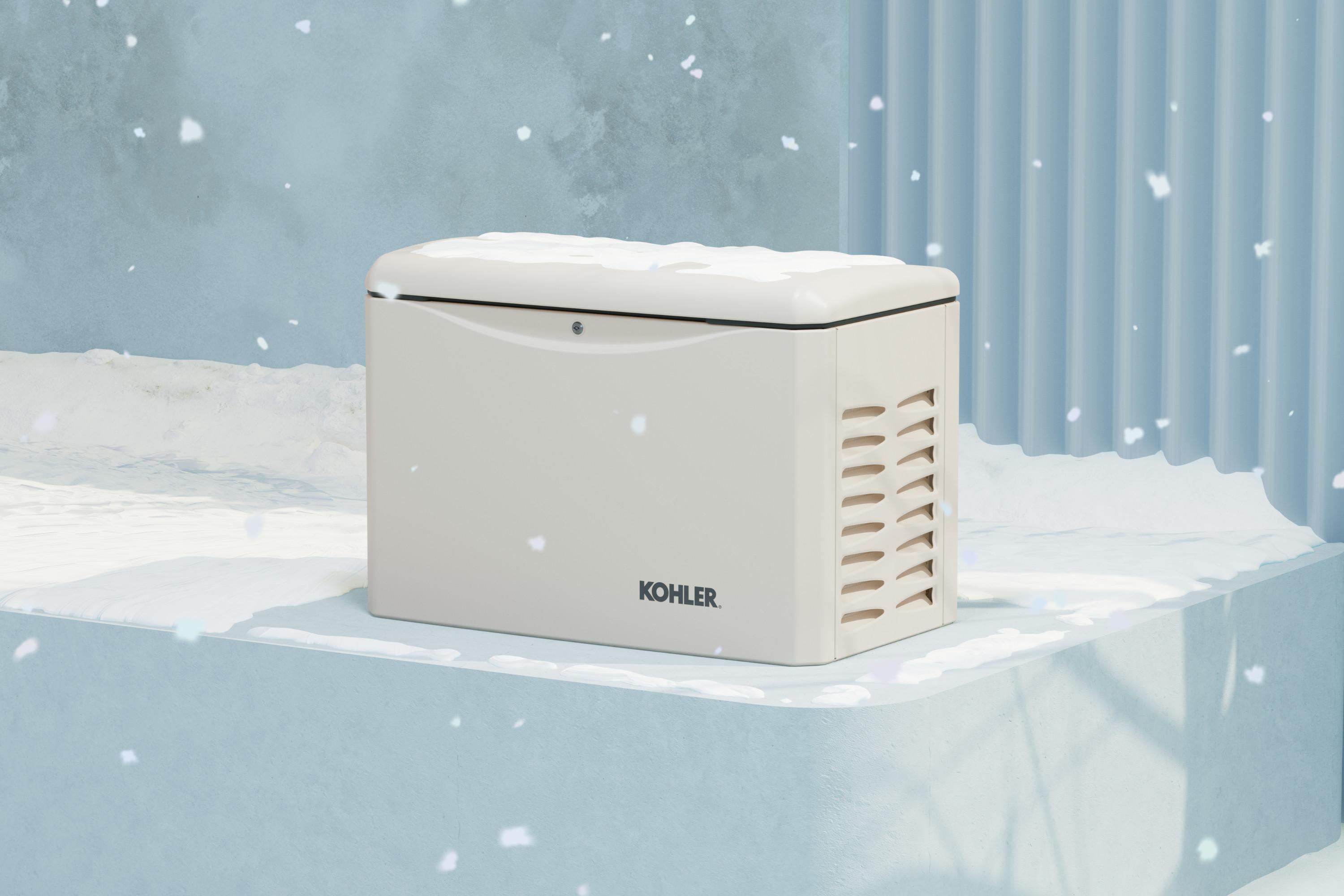 White Kohler home generator placed outdoors, surrounded by snow, demonstrating its durability, with snowflakes falling and a blue wall in the background.